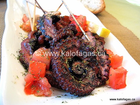Grilled octopus on skewers and dressed with extra-virgin olive oil, lemon juice and dried Greek oregano.
